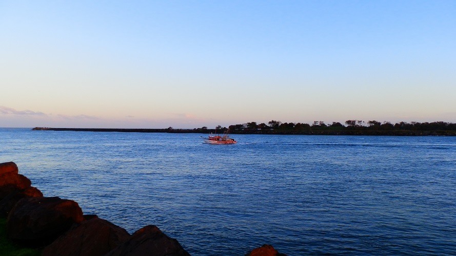 Prawn trawler heading down the Richmond River at Ballina, New South Wales