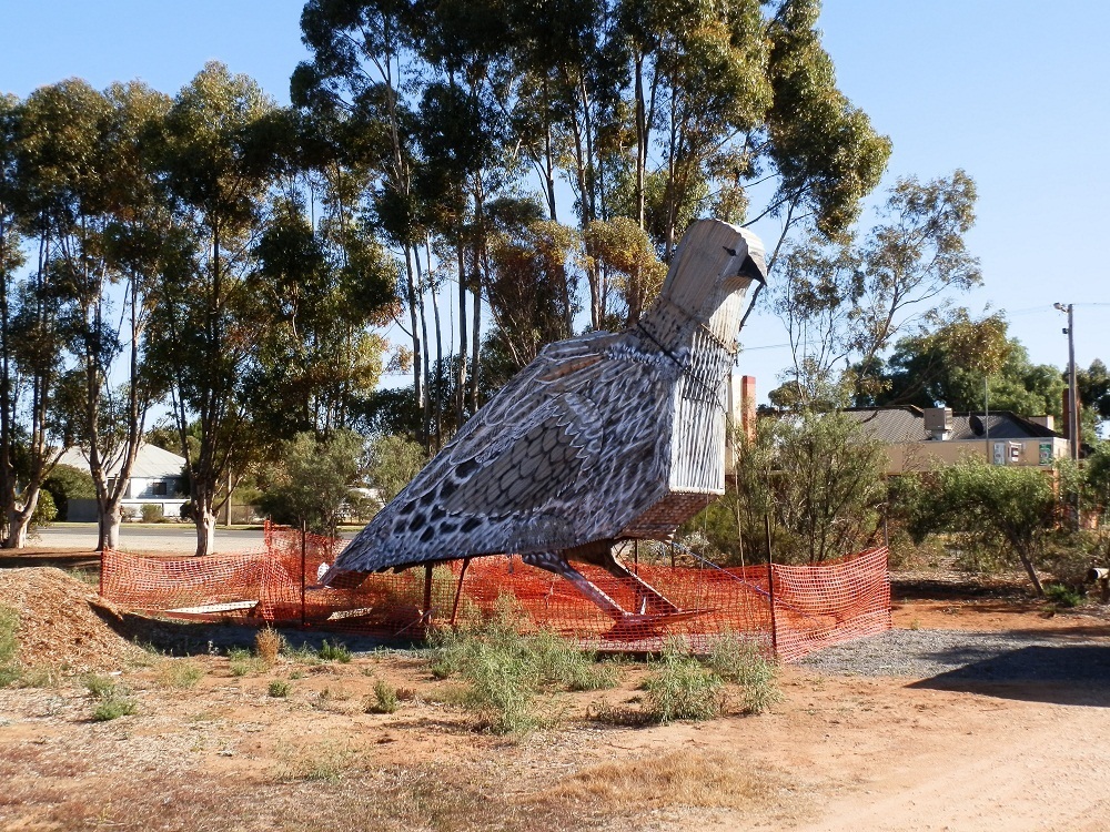 The Big Malleefowl against the backdrop of its home town, Patchewollock