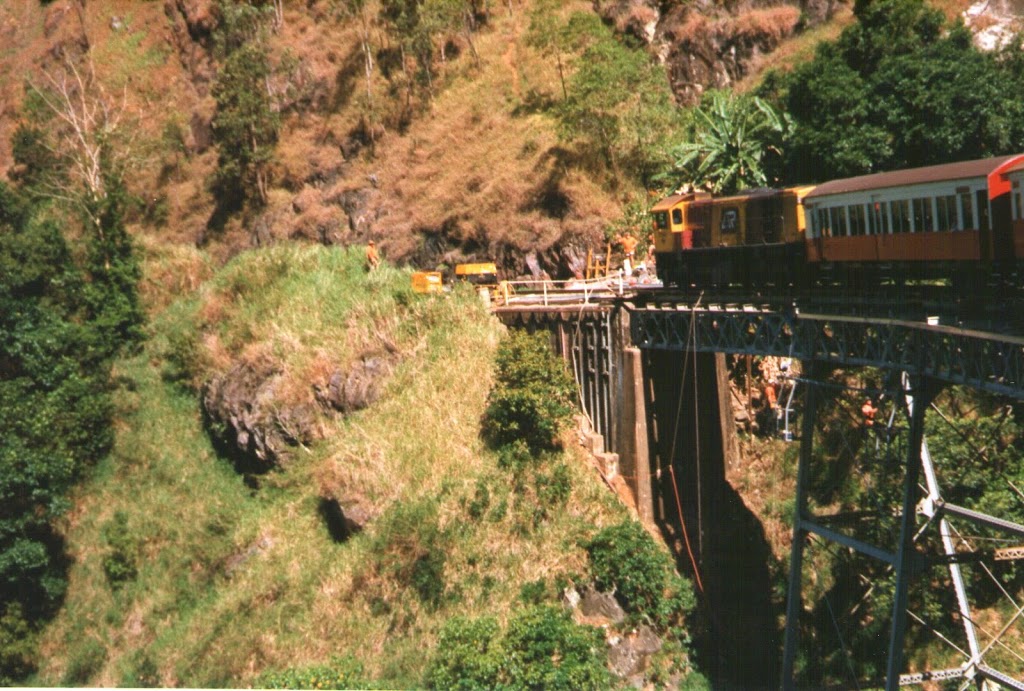 Yep! That's a road crew repairing the track ... Kuranda Scenic Railway