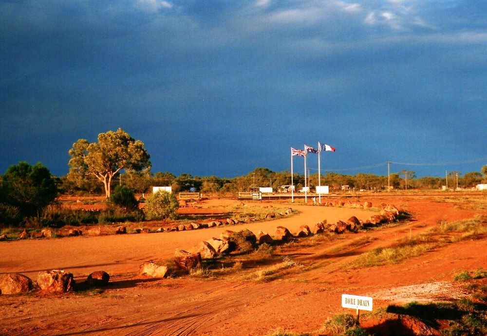 London, Paris, Thargomindah - Flags at the Thargomindah Hydro Power Plant, Outback Queensland